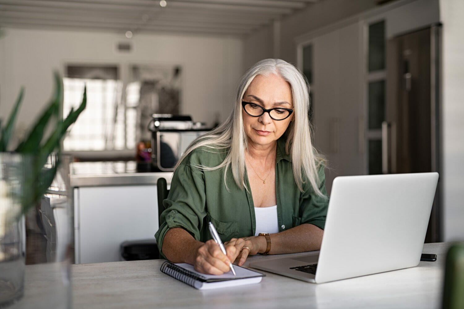 senior fashionable woman working at home PRY4EXQ scaled