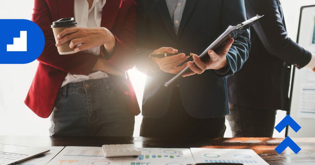 financial team reviewing marketing expenses