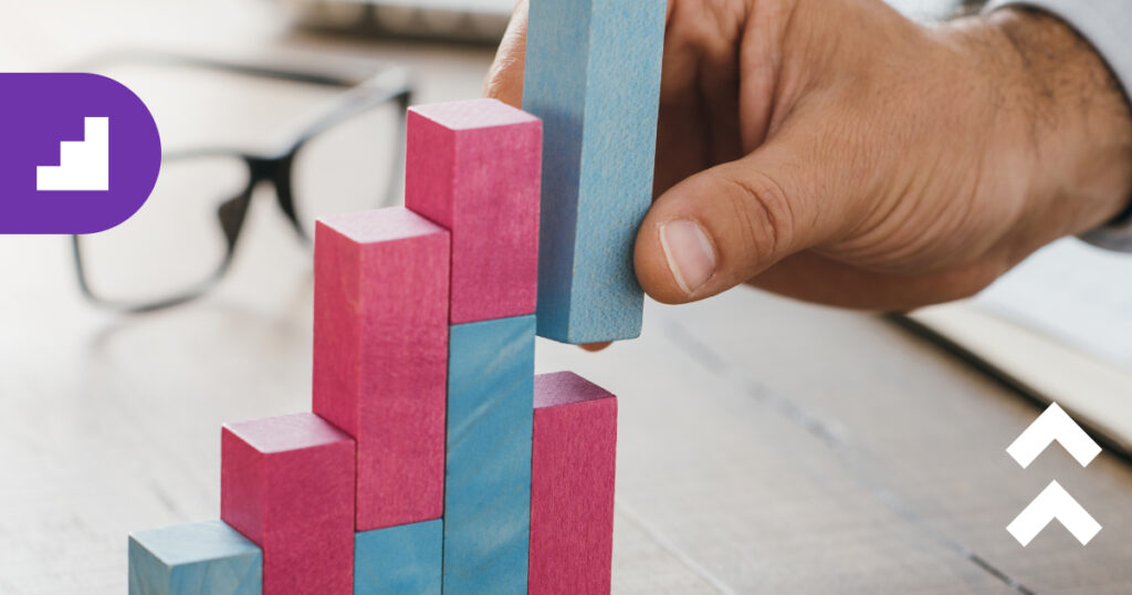 Businessman putting up blocks for ideal successful startup