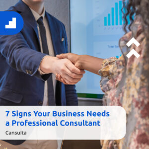 Business consultant shaking hands with a client, symbolizing partnership and professional guidance. Text overlay: 7 Signs Your Business Needs a Professional Consultant – Cansulta.