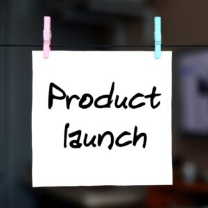 Product launch. Note is written on a white sticker that hangs wi