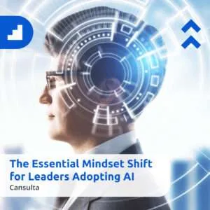 A business professional in a suit looking forward with a futuristic digital interface overlay around his eye, symbolizing AI and technology. On the left, a blue geometric logo appears. Text on the image reads: ‘The Essential Mindset Shift for Leaders Adopting AI – Cansulta.’