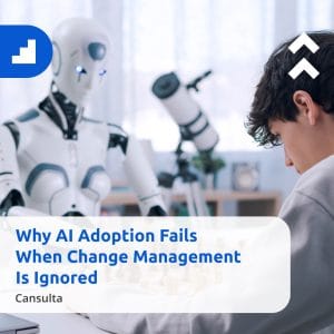 A man looking at a robot, reflecting on AI adoption and the impact of change management in the workplace.