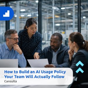 A diverse group of four business professionals—two women and two men—gathered around a conference table in a modern, glass-walled office. They are looking intently at a laptop and documents, appearing engaged in a serious but collaborative discussion. Title says "How to Build an AI Usage Policy Your Team Will Actually Follow." with Cansulta Branding.