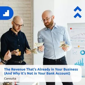 Two men in an office count revenue beside a whiteboard with charts and graphs. One holds dollar bills and a notebook, while the other has coins. Overlay text reads “The Revenue That's Already in Your Business (And Why It's Not in Your Bank Account)” with Cansulta Branding.