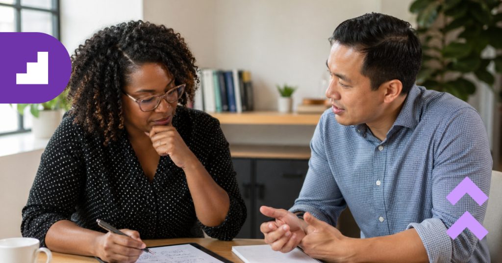 A business leader and a consultant reviewing a strategic decision-making framework together in an office, illustrating the process of determining if an organization needs external consulting.