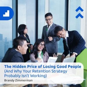 Four professionally dressed colleagues are gathered around a table in a modern office, smiling and discussing paperwork. Title says "The Hidden Price of Losing Good People: What Employee Attrition Is Really Costing Your Business" with Cansulta Branding.